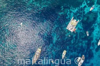 Arial foto of boats in Crystal Bay, Comino