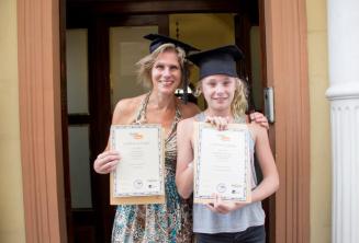 A mother and child who have both completed a language curs