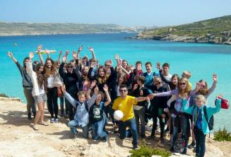 A group of language camp studenți on a trip to Comino, Malta