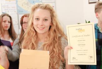 junior language student with her curs de engleză certificate
