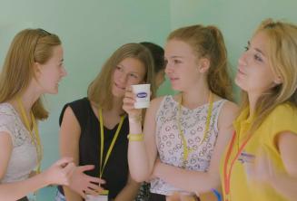 profesor and group leader talking with studetns